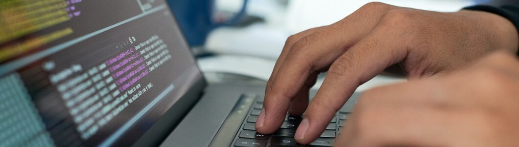 Photo of a trainee busy coding
